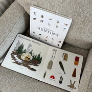Children's book titled 'The Big Book of Hunting' on a textured surface
