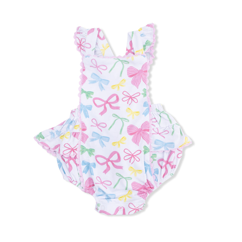 One-piece sunsuit with bow pattern on a white background