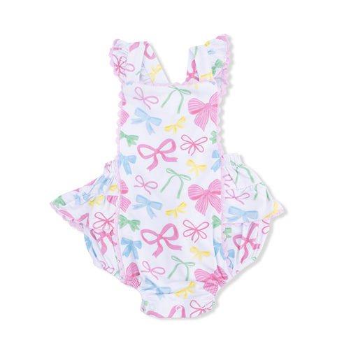 One-piece sunsuit with bow pattern on a white background