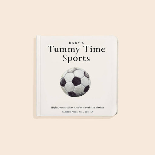 Book titled 'Baby's Tummy Time Sports' with a soccer ball illustration on a beige background