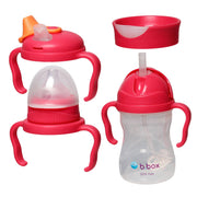 Two baby bottles with pink lids and handles on a white background