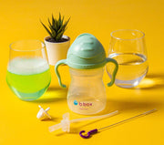 Bbox sippy cup with accessories on a yellow background