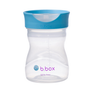 Clear b.box sippy cup with blue lid on a white background