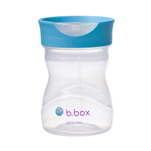 Clear b.box sippy cup with blue lid on a white background