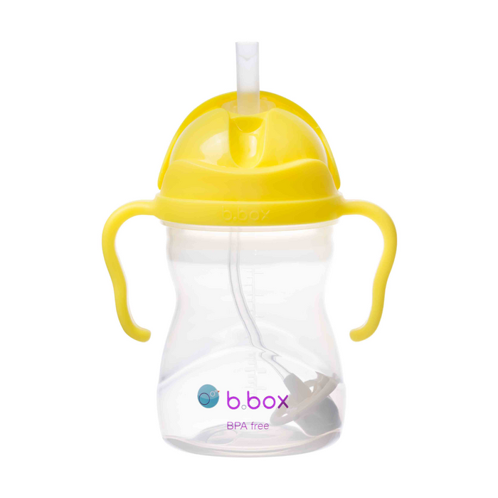 Yellow sippy cup with a straw on a white background, featuring the b.box logo.