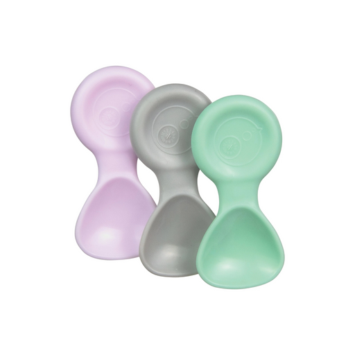 Three pastel-colored silicone baby spoons on a white background