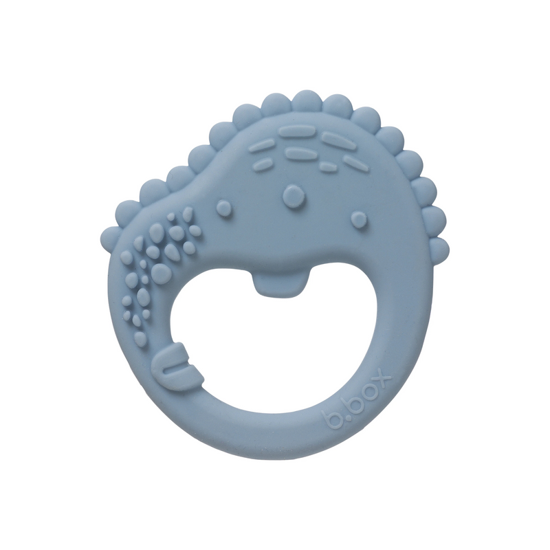 Blue silicone teething ring with textured surface on a white background