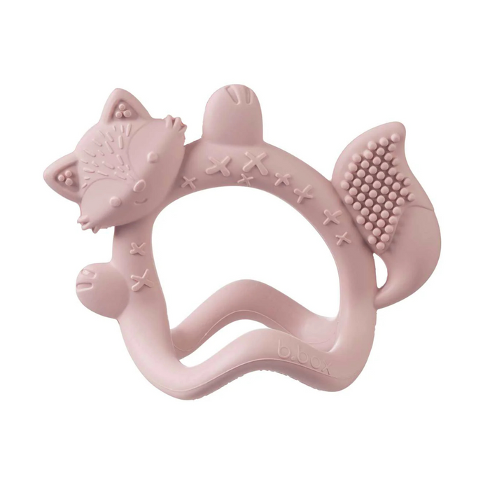 Pink fox-shaped teething ring on a white background