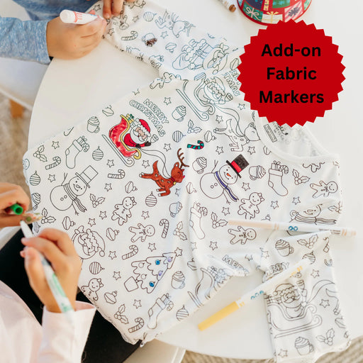 Children coloring Christmas colorable pajamas with fabric markers