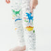 Close-up of pajama pants showing colored and uncolored dinosaur illustrations