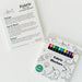 Fabric markers and instruction card displayed beside colorable pajama fabric