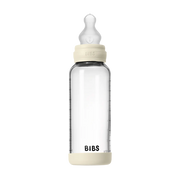 BIBS baby glass bottle with silicone nipple and measurement markings on a white background