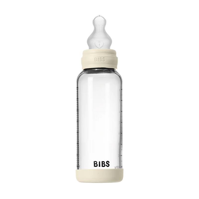 BIBS baby glass bottle with silicone nipple and measurement markings on a white background