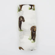 Rolled Saltwater Swaddles Boykin Spaniel swaddle blanket showing hand-painted Boykin dog illustrations on white fabric