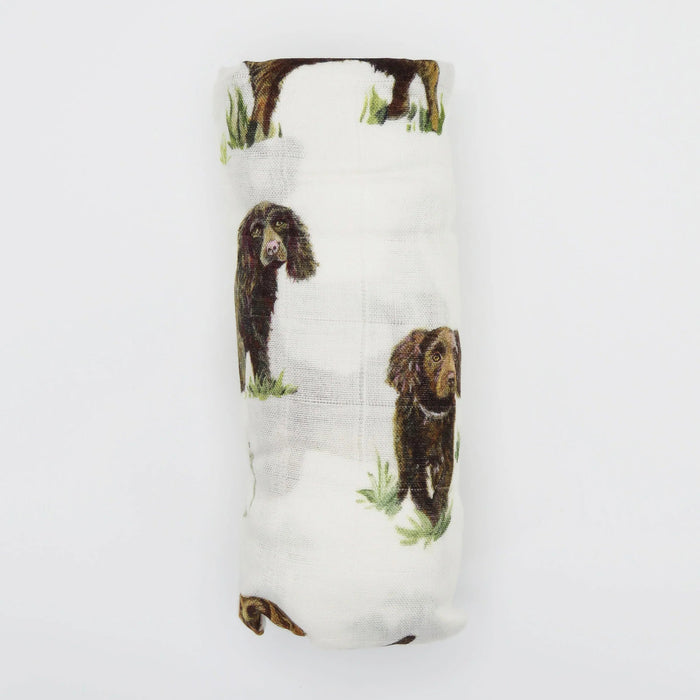 Rolled Saltwater Swaddles Boykin Spaniel swaddle blanket showing hand-painted Boykin dog illustrations on white fabric