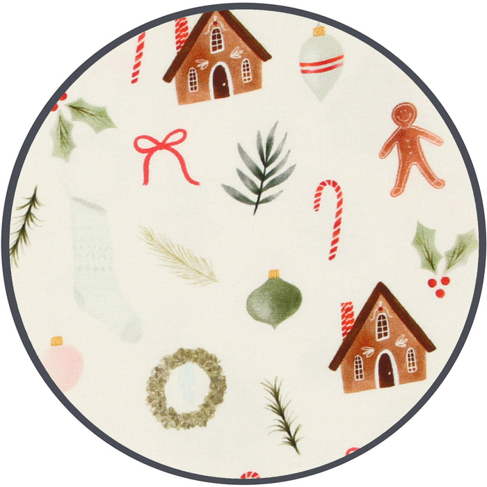 Round plate with Christmas-themed illustrations including houses, candy canes, and wreaths on a white background.