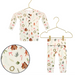 Baby outfit with long-sleeve shirt and pants on hangers, featuring a Christmas-themed pattern.