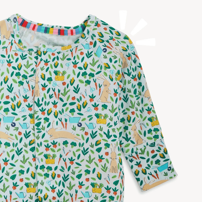 Close-up of Bunny Garden pajama top with magnetic neckline and botanical print