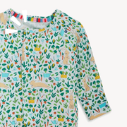 Close-up of Bunny Garden magnetic footie with botanical print and fold-over cuffs