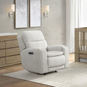 Gray recliner chair in a room with wooden furniture and light decor
