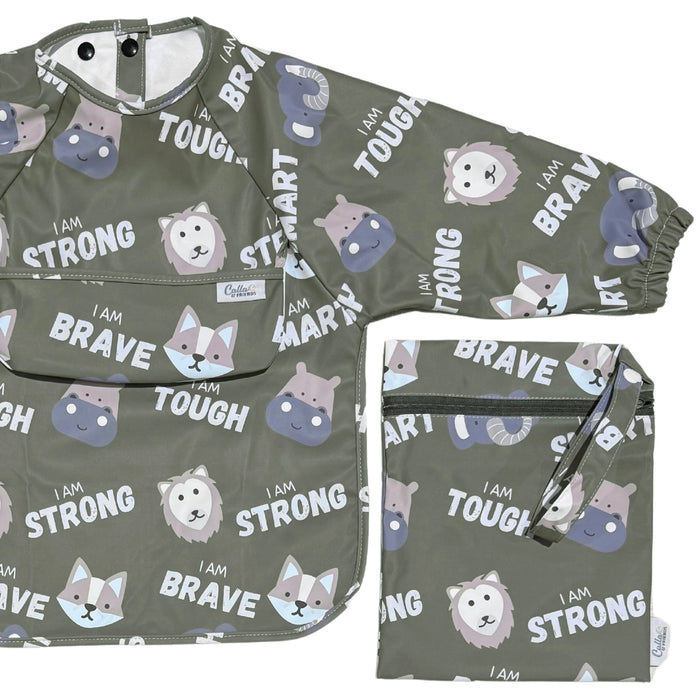 Pine green long sleeve smock bib with affirmations print and matching zip pouch shown flat