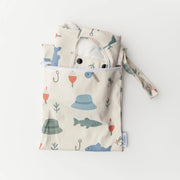 Baby outfit with hood and patterned bag on a white background