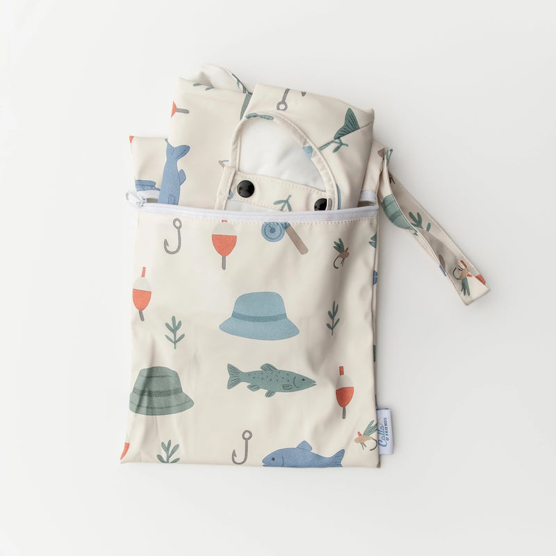 Baby outfit with hood and patterned bag on a white background