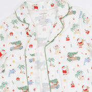 Close-up of the Angel Dear Beach Christmas adult pajama top with notch collar, green piping and coastal Santa print