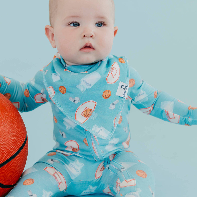 Close-up of a baby wearing the blue basketball Copper Pearl All Star bandana bib