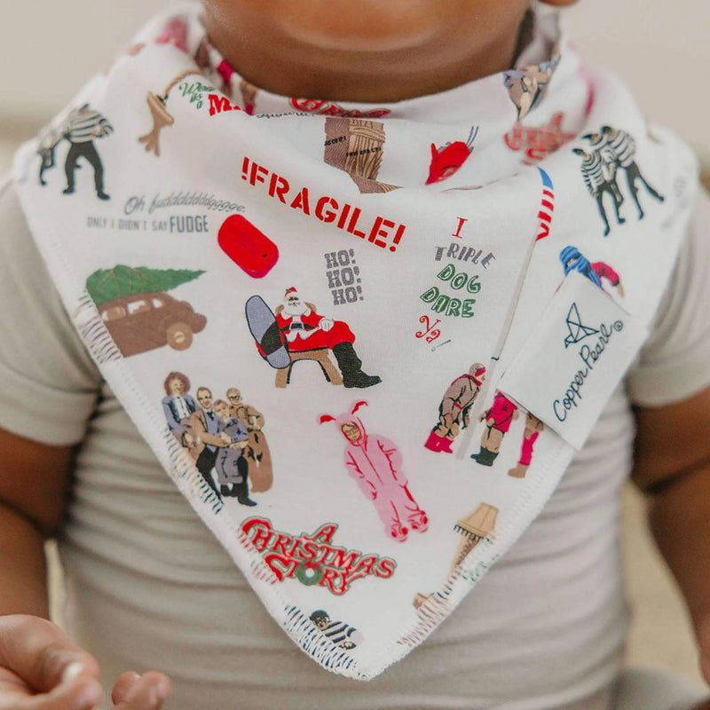 Close-up of baby wearing white Christmas icons Copper Pearl bandana bib