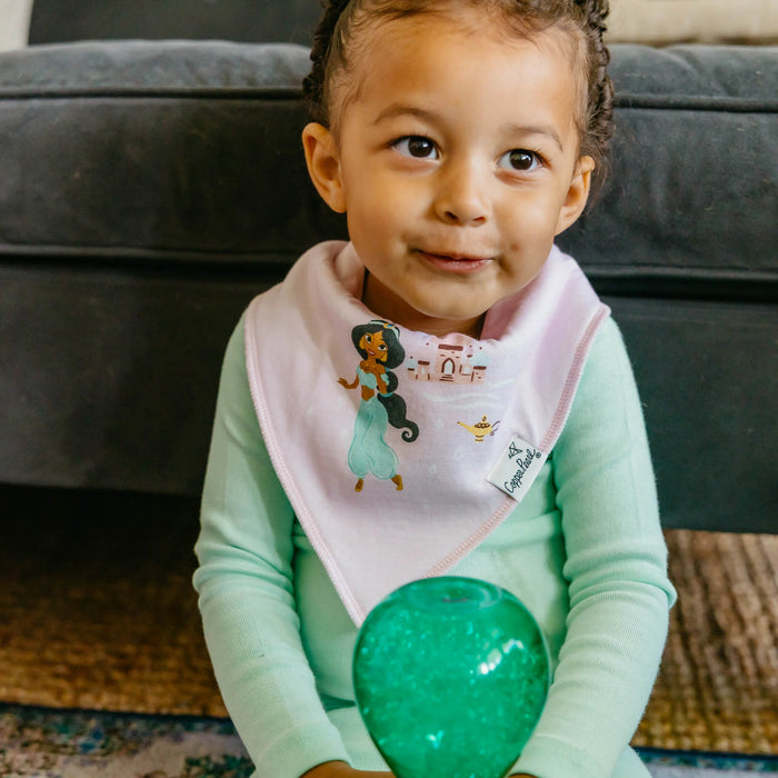 Baby sitting on floor wearing pink Copper Pearl bandana bib with Jasmine
