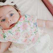 Close-up of a baby wearing the pink rose Copper Pearl Genevieve bandana bib