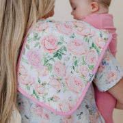 Close-up of the pink rose print and pink trim on a Copper Pearl Genevieve burp cloth