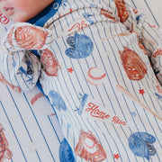 Close-up of the Copper Pearl All Star baseball print on the newborn knotted gown