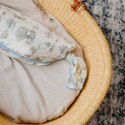 Close-up of the knotted bottom on the Copper Pearl Hundred Acre Wood newborn gown