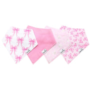Four pink and white baby bandanas with bows, flowers, and butterflies, arranged in a fan shape on a white background.