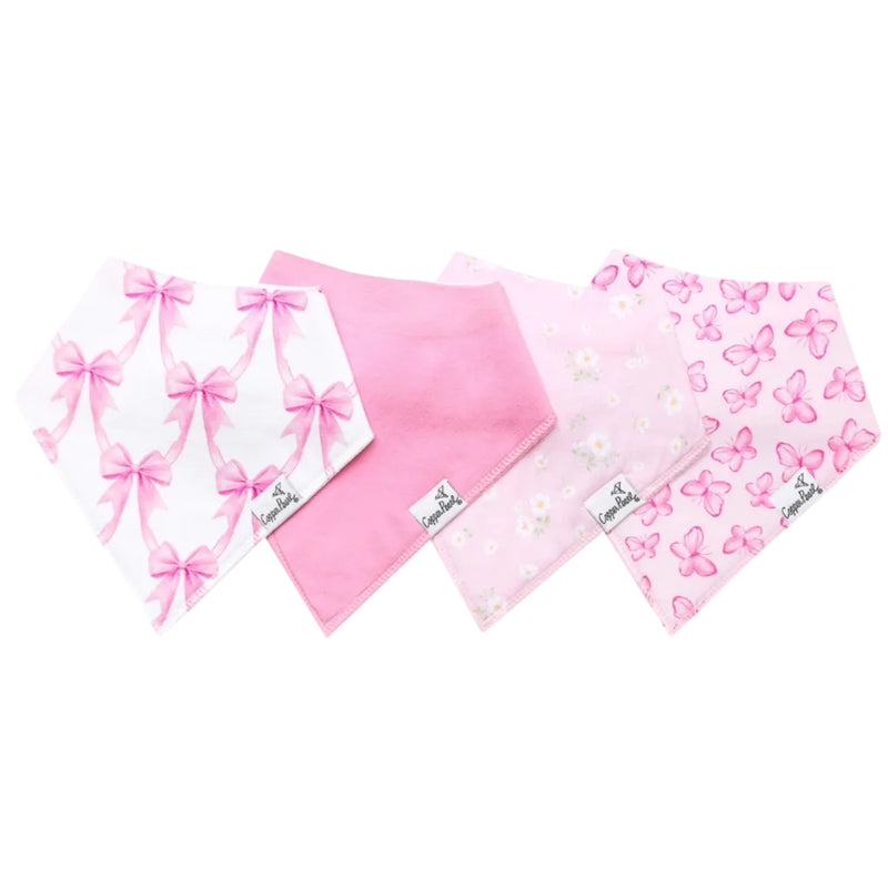 Four pink and white baby bandanas with bows, flowers, and butterflies, arranged in a fan shape on a white background.