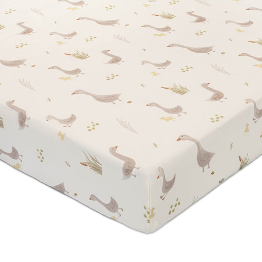 Close-up of Charlie Farmhouse Goose fitted crib sheet with neutral goose illustrations