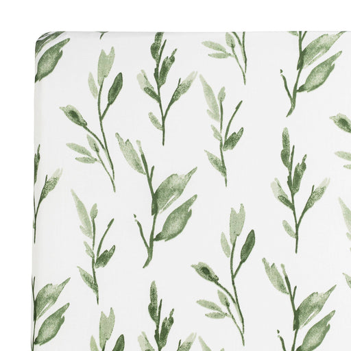 Fabric with green leaf pattern on a white background