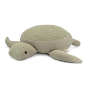 Knitted turtle toy on a white background