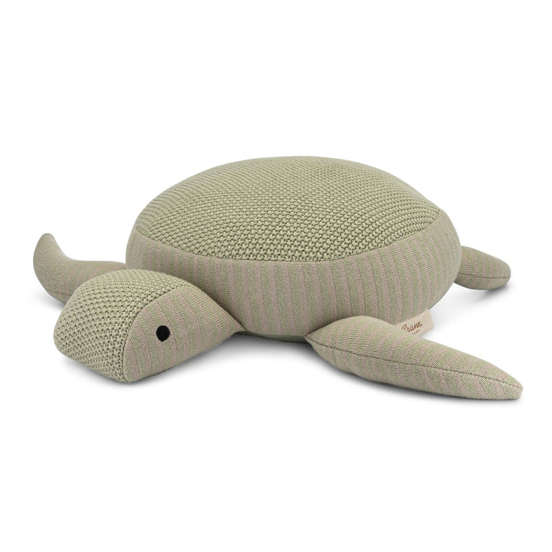 Knitted turtle toy on a white background