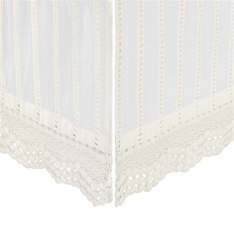White lace curtain with scalloped edge on a white background