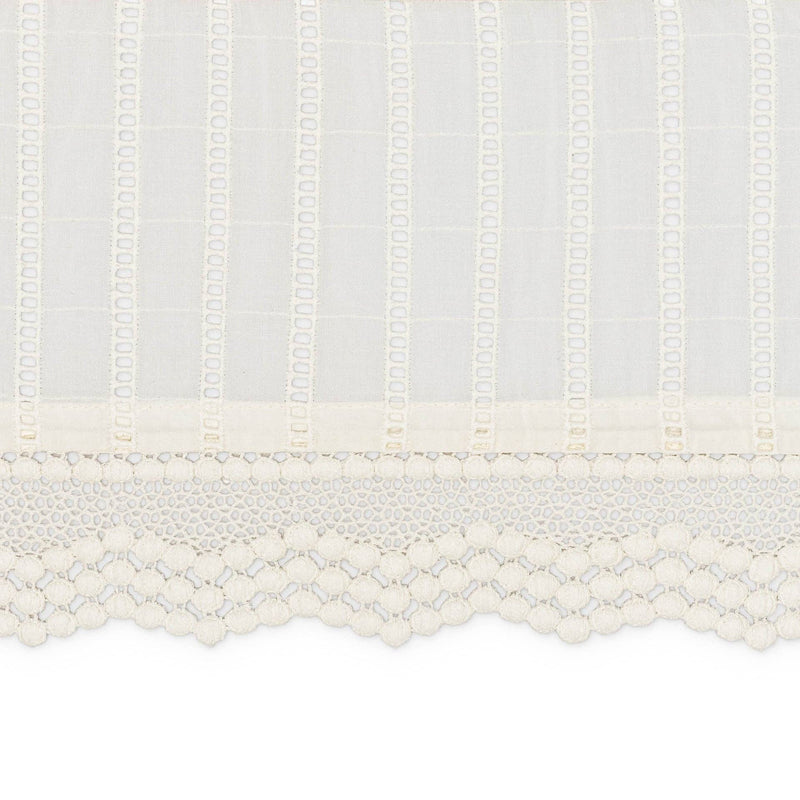 Close-up of a textured white fabric with a subtle pattern on a white background