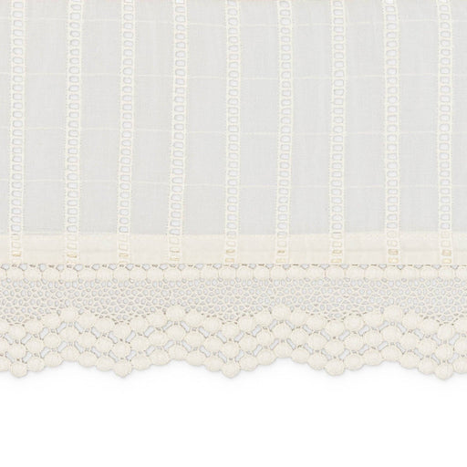 Close-up of a textured white fabric with a subtle pattern on a white background