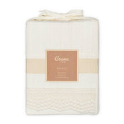 Folded baby blanket with 'Crane Baby' label on a white background