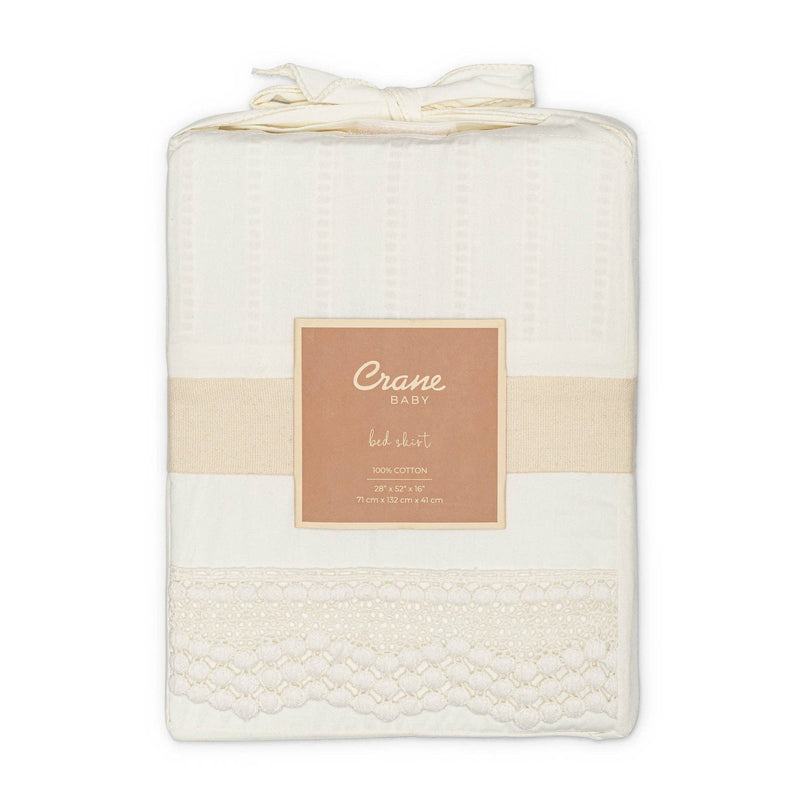 Folded baby blanket with 'Crane Baby' label on a white background