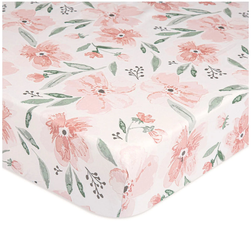 Close-up of Parker Floral fitted crib sheet with pink watercolor flowers and green leaves