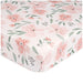 Close-up of Parker Floral fitted crib sheet with pink watercolor flowers and green leaves