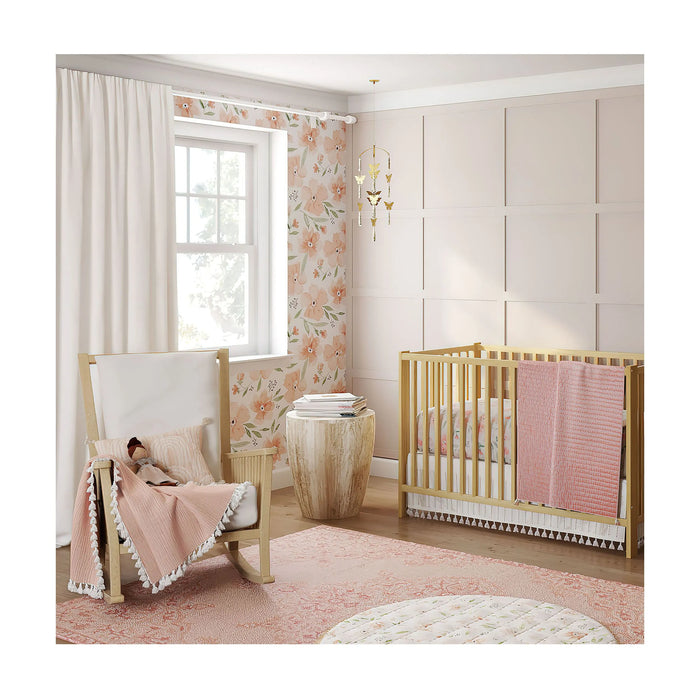 Nursery room setup with Parker Floral bedding, natural wood crib, and soft pink décor