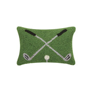 Decorative pillow with golf club and ball design on a green background